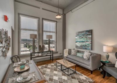 fully furnished living room of an apartment at the maclellan