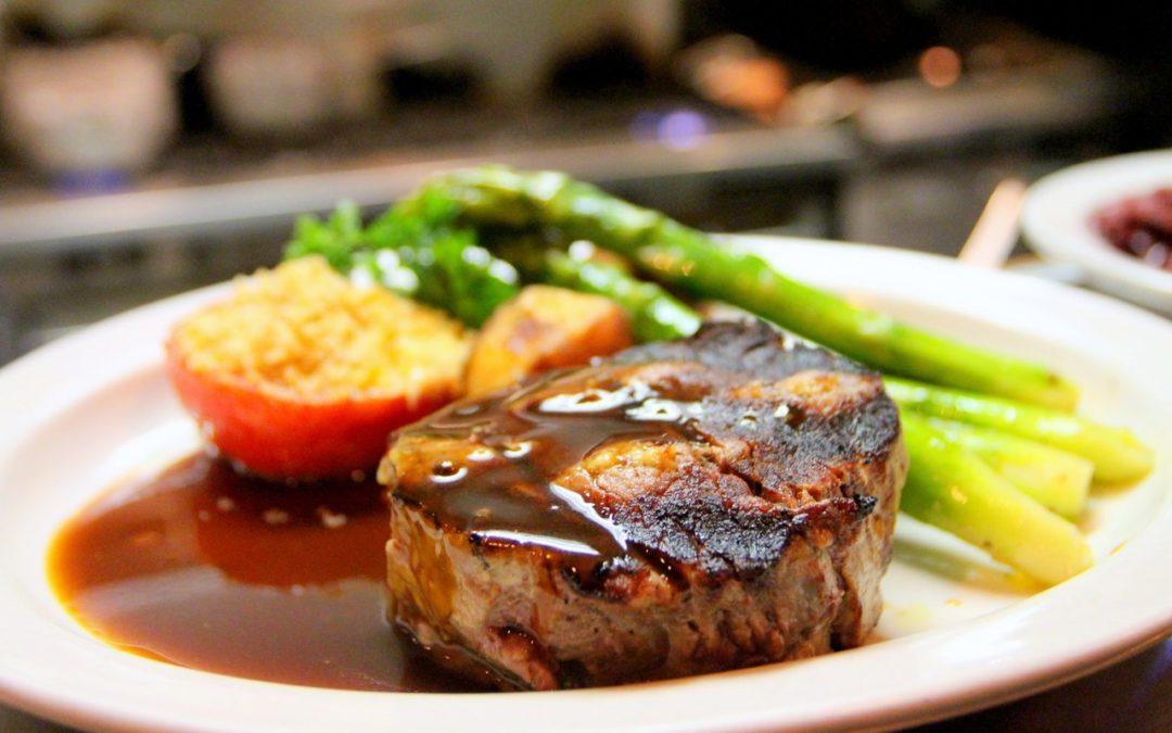 close up view of steak and asparagus