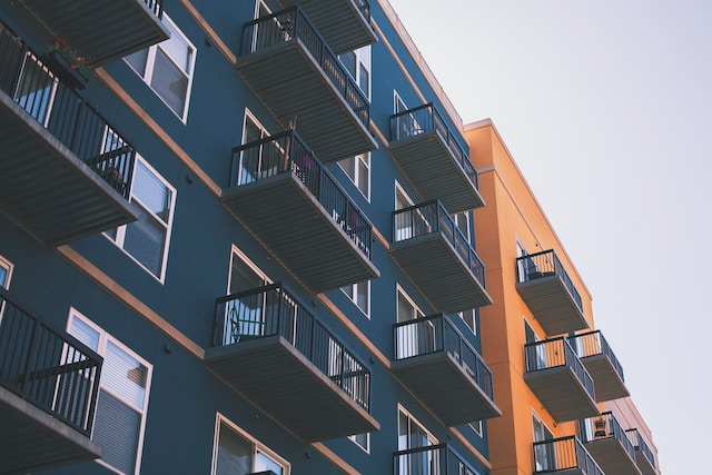 low angle view of blue and orange apartment buildings